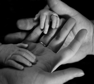 family hands together mum and baby - postpartum doula helsinki